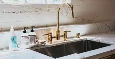 white ceramic sink with faucet