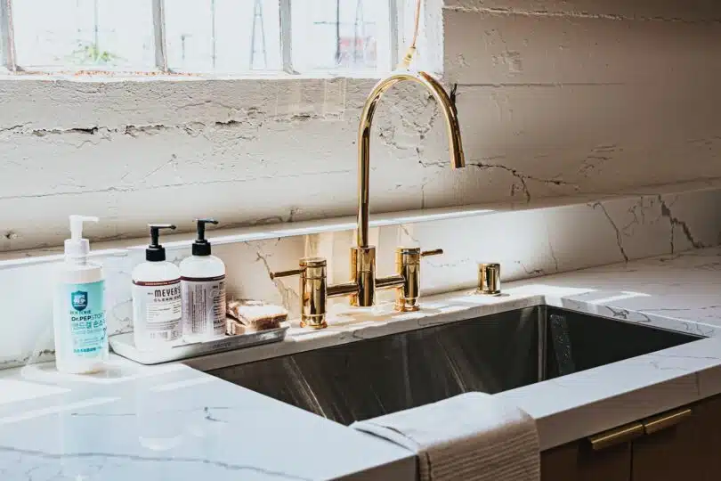 white ceramic sink with faucet